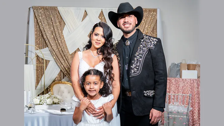 Estefany Rodríguez and her husband and child