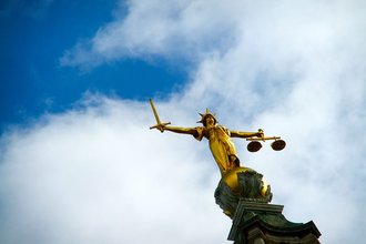 Justice statue atop the Old Bailey criminal court