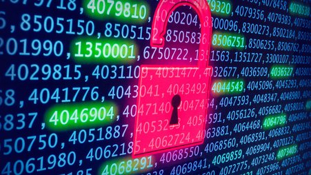 Image of a lock hovering over a computer screen containing many data points.