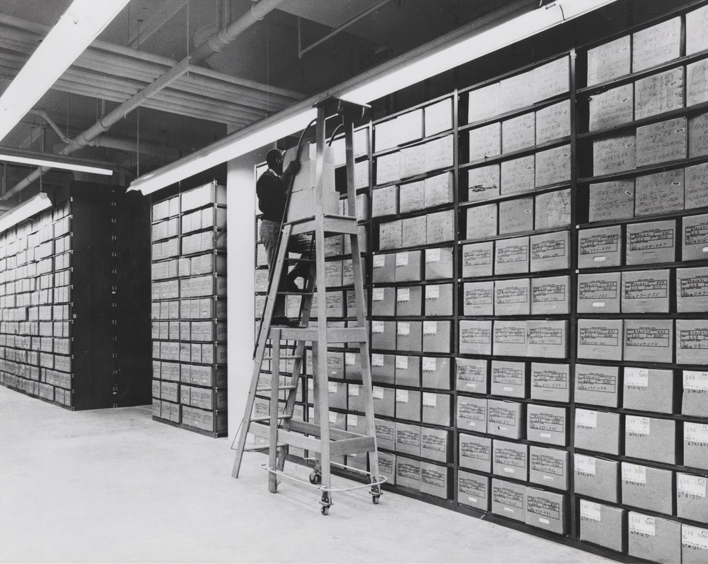An archivist at work in the stacks.