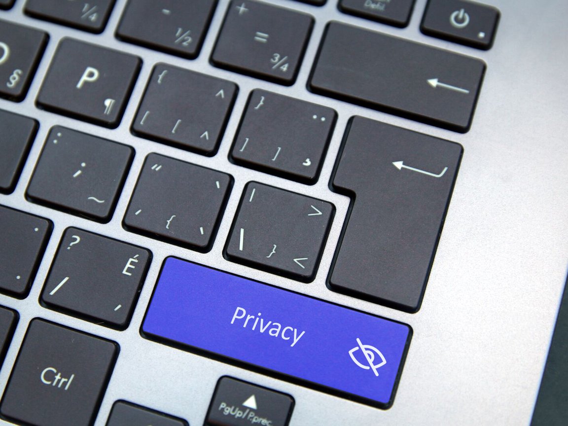 Photo of the right side of a computer keyboard with the shift button labeled "Privacy," with a logo of an eye with a line through it