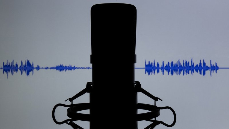 Microphone with sound wave in the background