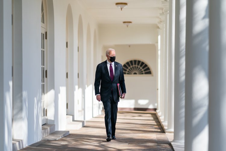 Biden walking through the White House