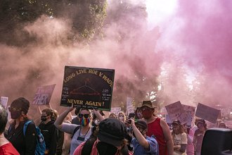 Photo of pro-choice protesters at a rally holding signs
