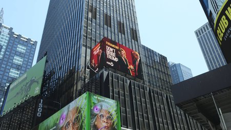 Image of Times Square billboard that reads: "DON'T BRIBE TRUMP"
