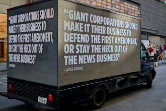 A mobile billboard quoting legendary First Amendment lawyer James Goodale during an April protest in New York against the Paramount-Warner Bros. merger. The billboard reads “Giant corporations should make it their business to defend the First Amendment, or stay the heck out of the news business.”
