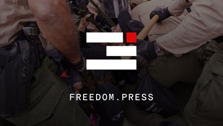 The FPF logo and website URL freedom.press overlaid on top of a dramatic photo of a law enforcement and journalist scuffle.