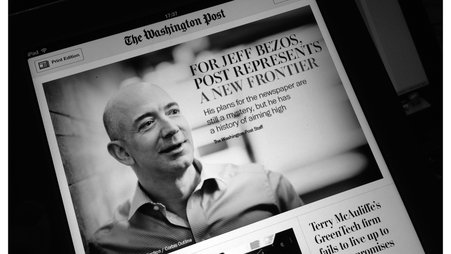 The front page of The Washington Post with a picture of Jeff Bezos and the headline and subtitle "For Jeff Bezos, Post Represents a New Frontier: His plans for the newspaper are still a mystery, but he has a history of aiming high"