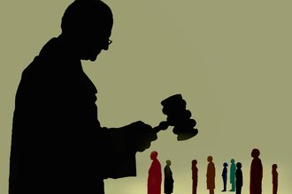 Judge with gavel over group of people