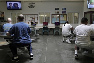 Incarcerated people watching television at a California prison.