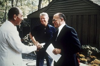 President Carter, center, meets with Egyptian president Anwar Sadat, left, and Israeli Prime Minister Menachem Begin at Camp David in 1978.