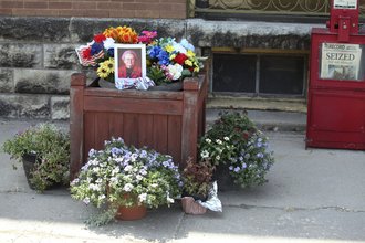A tribute to Joan Meyer, the late 98-year-old co-owner of the Marion County Record, sits outside the weekly newspaper's office, Monday, Aug. 11, 2023, in Marion, Kansas. Her son, editor and publisher Eric Meyer, blames the stress from police raids on the newspaper offices and their home for her death on Aug. 12, the day after the raids.