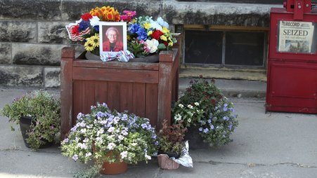 A tribute to Joan Meyer, the late 98-year-old co-owner of the Marion County Record, sits outside the weekly newspaper's office, Monday, Aug. 11, 2023, in Marion, Kansas. Her son, editor and publisher Eric Meyer, blames the stress from police raids on the newspaper offices and their home for her death on Aug. 12, the day after the raids.