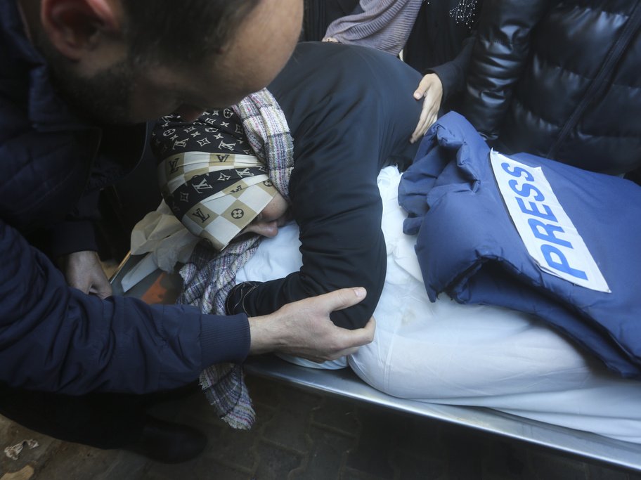 A relative mourns Palestinian journalist Akram Al-Shafi'i in January, after he was killed in an Israeli bombardment of the Gaza strip.