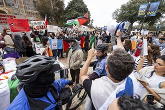 Pro-Palestinian demonstrators and pro-Israel demonstrators clash at the University of California, Los Angeles on April 25, 2024.