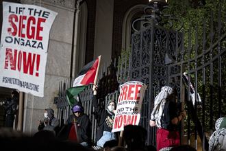 Protesters gather near a main gate at Columbia University in New York City in April 2024.
