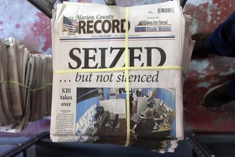 A stack of the Marion County Record sits in the back of the newspaper's building, Aug. 16, 2023, in Marion, Kansas