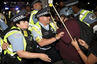Protesters clash with police during a demonstration outside the Democratic National Convention on Aug. 22, 2024, in Chicago.