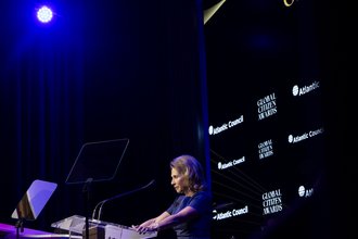 Shari Redstone, chair of Paramount, stands behind a lectern in front of a black background at an awards dinner in New York, New York, in September 2024.