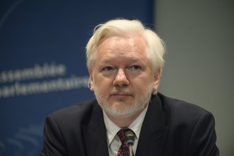 In his first appearance after his prolonged detention, Julian Assange speaks during a hearing at the Parliamentary Assembly of the Council of Europe on Oct. 1, 2024.