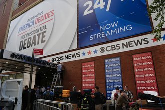 Members of the press gather ahead of a CBS News vice presidential debate last year.