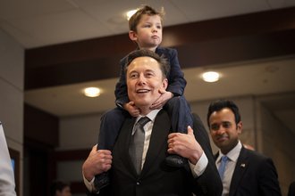 Elon Musk carries his son to a meeting on Capitol Hill to discuss DOGE with lawmakers.