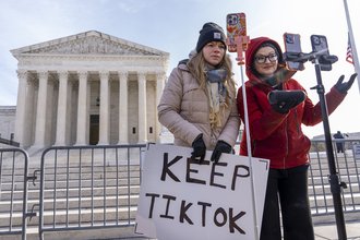 TikTok users live stream outside the Supreme Court during Jan. 10 arguments over the law to ban the platform.