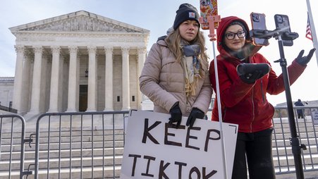 TikTok users live stream outside the Supreme Court during Jan. 10 arguments over the law to ban the platform.