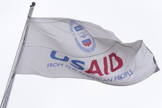 The flag of the United States Agency for International Development, or USAID, flies in front of the USAID office in Washington, Monday, Feb. 3, 2025