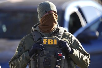 An FBI agent pictured during an operation in 2025.