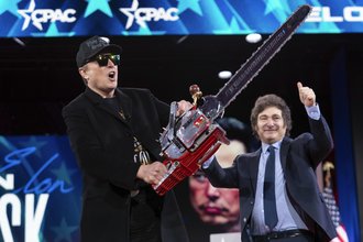 Elon Musk holds a chainsaw at the Conservative Political Action Conference on Feb. 20, 2025.