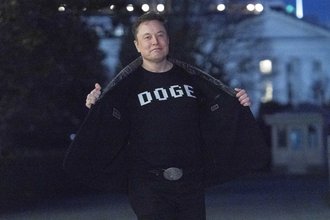 Elon Musk in a DOGE shirt