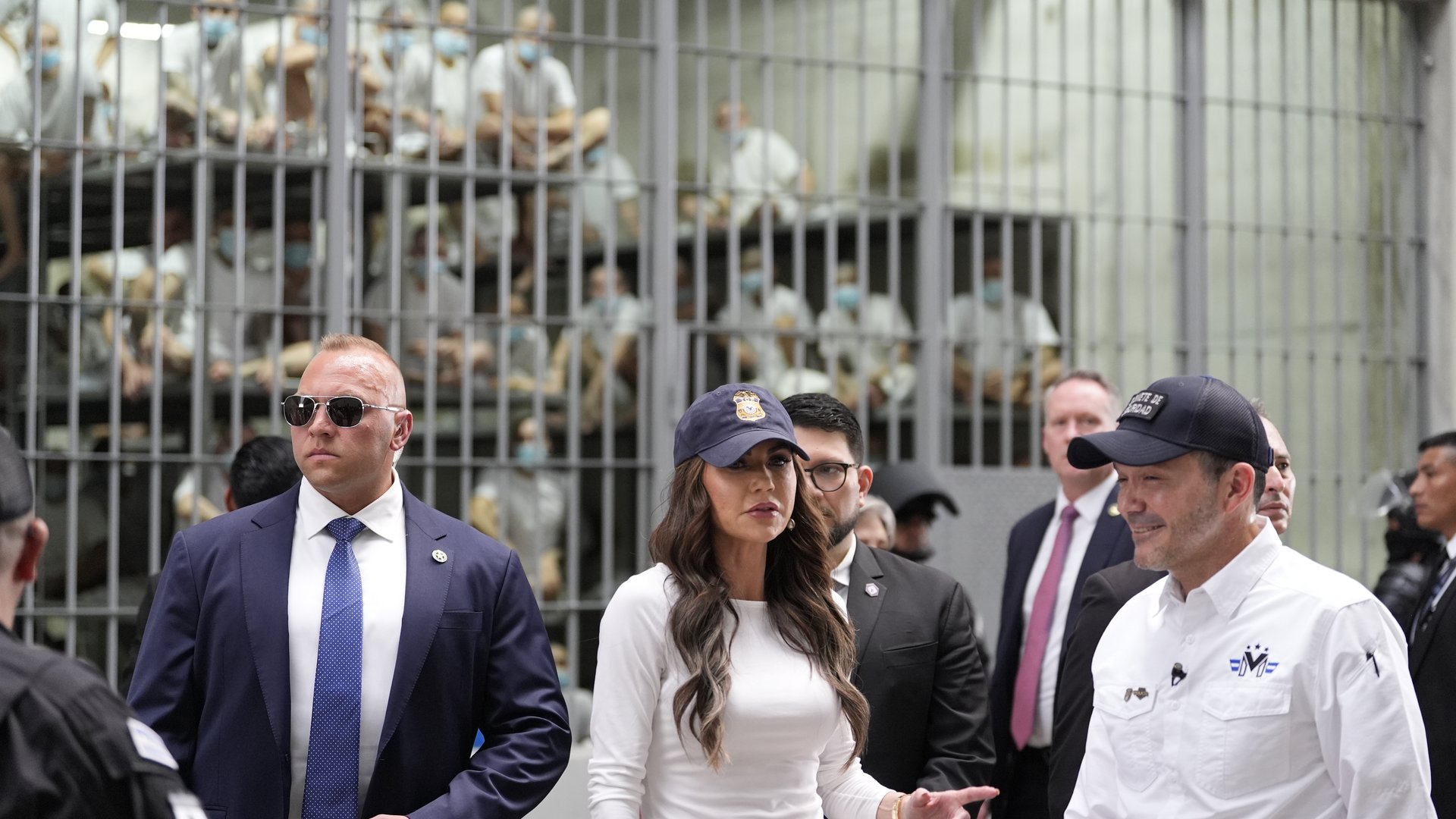 Homeland Security Secretary Kristi Noem, accompanied by Minister of Justice and Public Security Héctor Gustavo Villatoro, right, tours the Terrorism Confinement Center in Tecoluca, El Salvador