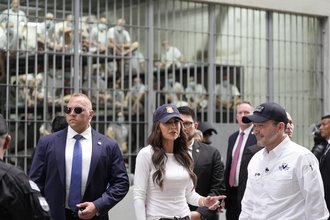 Homeland Security Secretary Kristi Noem, accompanied by Minister of Justice and Public Security Héctor Gustavo Villatoro, right, tours the Terrorism Confinement Center in Tecoluca, El Salvador