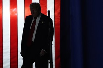 President Donald Trump walks on stage in Michigan to speak about the first 100 days of his second term - version 2