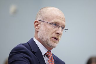 A close up of FCC Chair Brendan Carr at a senate hearing.