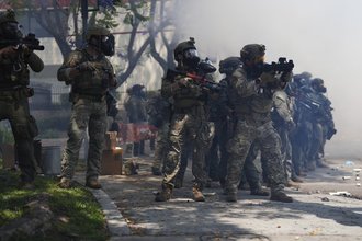 Law enforcement stand during a protest in Paramount, California, on June 7, 2025, after federal immigration authorities conducted operations. Southlander journalist Ben Camacho was shot with crowd-control munitions twice while covering protests that day.