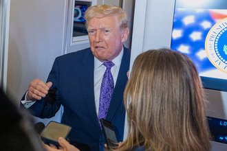 President Donald Trump talking to reporters.