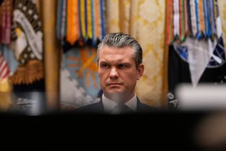 Defense Secretary Pete Hegseth listens as President Donald Trump speaks during a Cabinet meeting at the White House, Tuesday, Dec. 2, 2025, in Washington.