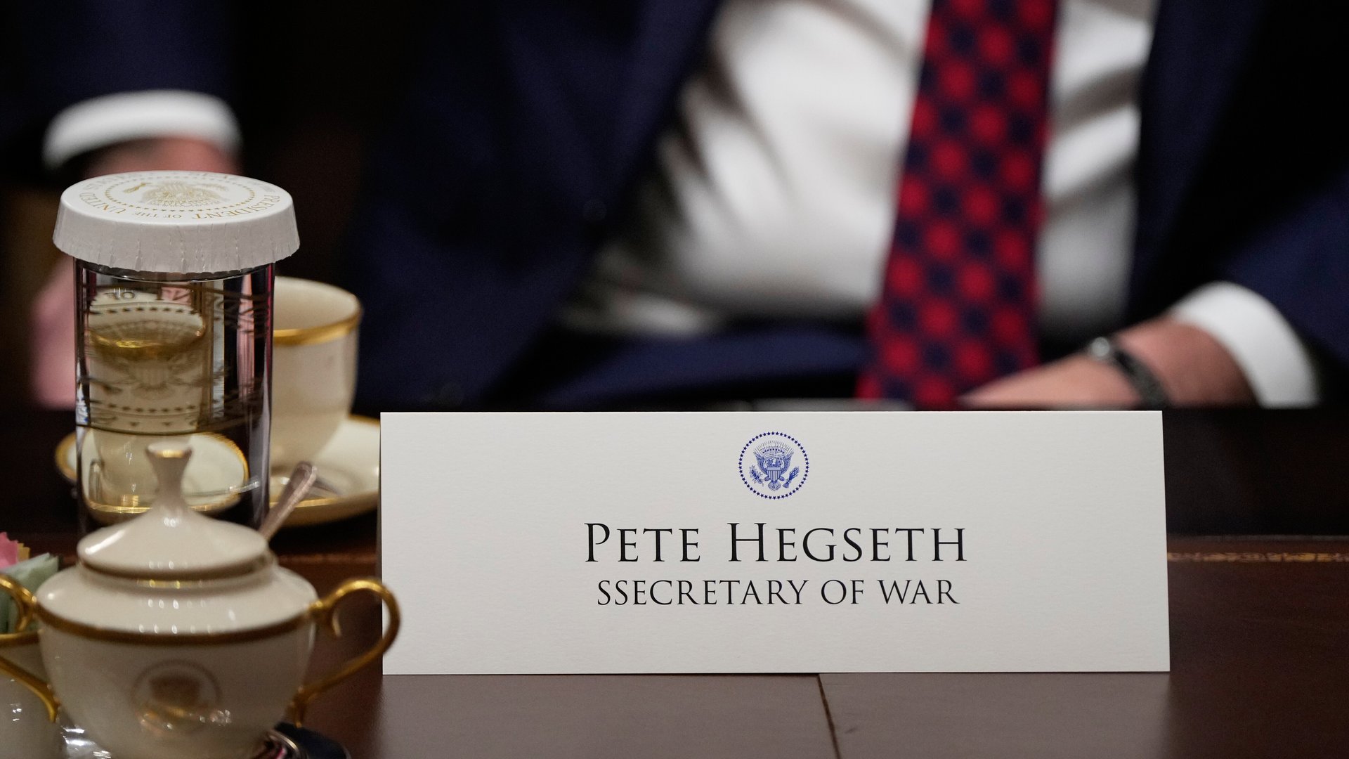 Secretary of Defense Pete Hegseth's name card is seen misspelled during a Cabinet meeting at the White House, Tuesday, Dec. 2, 2025, in Washington. (AP Photo/Julia Demaree Nikhinson)