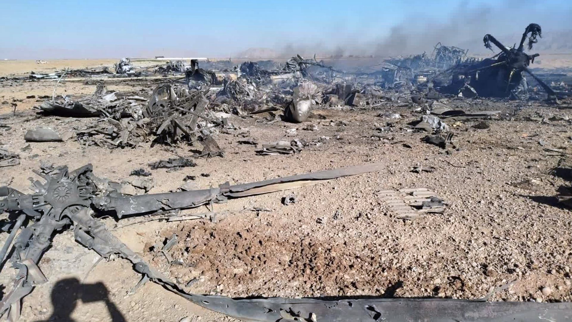 An image purportedly showing the wreckage of a downed American transport plane and two helicopters involved in a rescue mission in Iran.