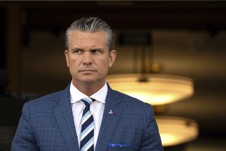 Defense Secretary Pete Hegseth is pictured, with his eyes looking sideways.