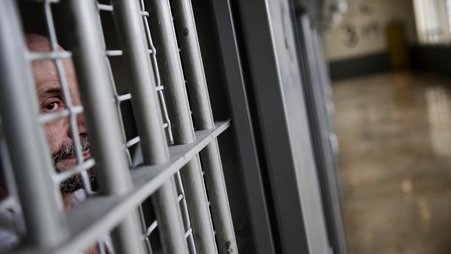 A prisoner looks out from his cell at the Georgia Diagnostic and Classification Prison, December 2015, in Jackson, Ga.