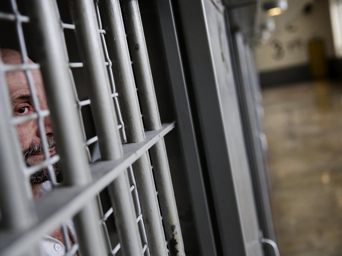A prisoner looks out from his cell at the Georgia Diagnostic and Classification Prison, December 2015, in Jackson, Ga.
