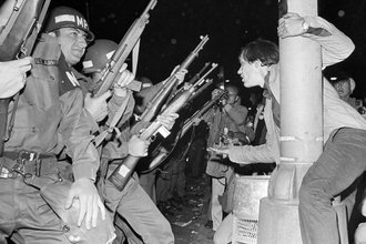 Chicago police officers attempt to disperse demonstrators outside the Conrad Hilton, Democratic Convention headquarters hotel, August 29, 1968