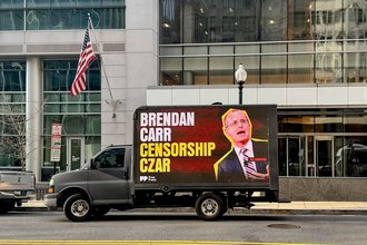 A mobile billboard in Washington, D.C., featuring Federal Communications Commission Chair Brendan Carr, part of a campaign by the advocacy group Free Press.