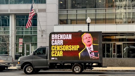 A mobile billboard in Washington, D.C., featuring Federal Communications Commission Chair Brendan Carr, part of a campaign by the advocacy group Free Press.