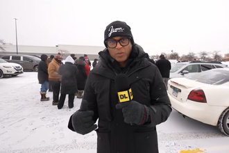 A person interviewing another person in a snowy area