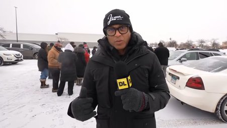 A person interviewing another person in a snowy area