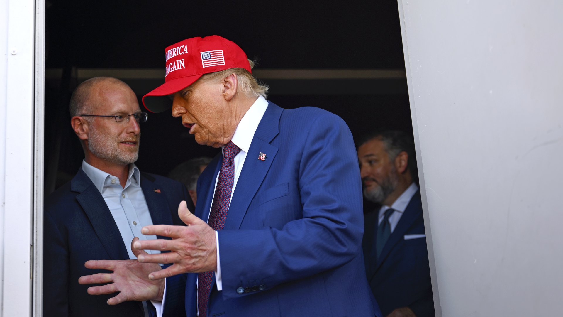 Donald Trump, then president-elect, speaks to incoming Federal Communications Commission Chair Brendan Carr.